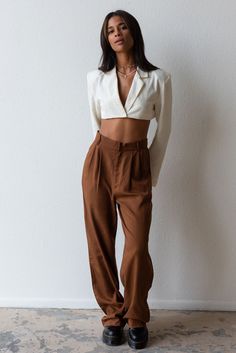 Meet your new fav pant for any season! Timeless and trendy are the Giselle Trouser featuring a loose fit with front pleat detail, side pockets and high waist. Color: Brown Loose Fit Front Pleats Pockets Wide Leg Mid Rise 100% Tencel Model is 5'7", size 25 in bottoms and is wearing size small High Waist Harem Pants For Work, Chic Relaxed Fit Tapered Leg Cargo Pants, Chic Tapered Leg Cargo Pants For Work, High Waist Harem Pants With Pockets For Day Out, Chic Harem Pants With Pockets For Day Out, Trendy Harem Pants With Loosely Fitted Hips For Work, Chic Relaxed Fit Cargo Pants, Chic High-waisted Cargo Pants For Day Out, Chic Relaxed Fit Cargo Pants For Work