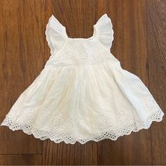 New With Tags, Never Worn! Square Neck, Flutter Sleeves, Eyelet Details. 100% Cotton. Comes With “Underwear” That Can Go Over A Diaper. Perfect For Spring And Summer. Size 12-18m. Flutter Sleeve Ruffle Dress For Playwear, Flutter Sleeve Dress With Ruffles For Playwear, White Dress With Ruffle Hem And Butterfly Sleeves, Cute Butterfly Sleeve Beach Dress, White Flutter Sleeve Dress For Playdate, White Ruffled Dresses With Butterfly Sleeves, White Butterfly Sleeve Dresses With Ruffles, White Dresses With Ruffles And Butterfly Sleeves, White Flutter Sleeve Playtime Dress