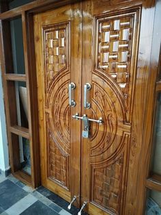 two wooden doors with decorative designs on the front and side panels are shown in this photo