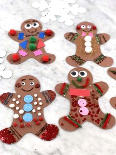 gingerbread cutouts are displayed on a marble surface