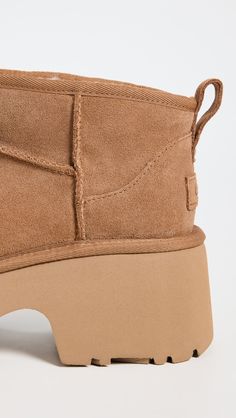 Cannot be shipped outside the USAUpper: Cowhide suedeChunky heelNo closure, pull-on designRound toeRubber soleImported, VietnamThis item cannot be gift-boxedStyle #UGGGG30296 Brown Ugg Boots, Chestnut Boots, Chestnut Uggs, Ugg Classic Ultra Mini, Ugg Classic, Platform Boots, Chunky Heel, Ugg Shoes, Suede Boots