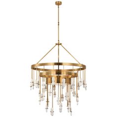 a brass chandelier with glass drops hanging from the ceiling