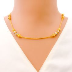 Elevate your ensemble with the Stylish Palatial 22k Gold Necklace. Weighing 10.0 grams and crafted with a purity of 22k, this necklace exudes sophistication. Its combination of yellow and white gold finishes adds a modern twist to its palatial design. With a length of 18 inches and non-adjustable links, it drapes elegantly around the neck. Secured with an S lock style, this necklace ensures both security and style. Make a statement with the refined allure of this exquisite gold necklace. PRODUCT Cheap Traditional Yellow Necklaces, Affordable Yellow Necklace With Gold Beads, Gold Dual-tone Necklace For Formal Occasions, Elegant 22k Gold Temple Necklace In Yellow, Elegant 22k Gold Yellow Temple Necklace, Elegant Yellow 22k Gold Temple Necklace, Elegant 22k Gold Temple Necklace In White, Elegant Gold Dual-tone Necklace, Elegant 22k Gold White Temple Necklace