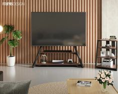 a flat screen tv sitting on top of a wooden stand in a living room next to a plant