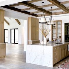 the kitchen is clean and ready to be used for cooking or baking, with an island in the middle