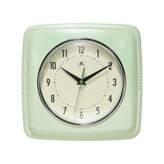 a green square clock with black hands on a white background