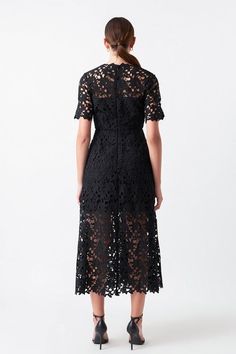 All over lace body midi dress, featuring see through short sleeves, attached lining, tuck details at skirt, and center back invisible zipper closure. Available in black. Shell: 100% Polyester Lining: 80% Polyester, 20% Cotton Outerwear Trends, Short Sleeve Midi Dress, Lace Body, Lace Short, Midi Short Sleeve Dress, Sleeve Midi Dress, Invisible Zipper, Trending Now, Sweater Skirt