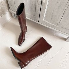 Slip into the epitome of comfort and elegance with our women's boots, meticulously crafted from cow leather with an intricate square toe design. Designed for winter, these boots are lined with luxurious pigskin and fine-tuned with a durable rubber outsole for ultimate comfort. The modest 4cm heel height and statuesque 37cm cylinder height mix pragmatism with poised sophistication. Don't let the colder months compromise your style; claim these boots now and take on winter with panache. Style Claim, Women Knee High Boots, Winter Boots For Women, Woman Shoes, Wristlet Wallet, Office Casual, Black 7, Toe Designs, Casual Everyday