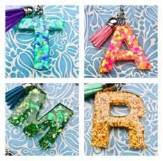 four different necklaces with letters and tassels on them