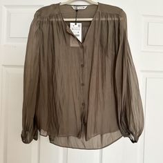 Light Weight Sheer Blouse With Buttons And Flowy Zara Khaki Tops For Fall, Neutral V-neck Blouse For Fall, Neutral Button-up Blouse For Fall, Chic Khaki Tops From Zara, Elegant Neutral Zara Tops, Taupe Long Sleeve Tops For Spring, Chic Khaki Blouse For Spring, Zara Brown Blouse For Work, Brown Zara Blouse For Summer