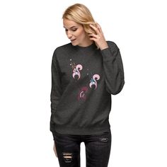 Wrap yourself in cozy and stylish comfort with our Floral Print Sweatshirt! This trendy and elegant sweatshirt features a beautiful flower print, making it both fashionable and soft to the touch. Perfect for any occasion, our sweatshirt is a must-have for any woman's wardrobe. Rock a classic sweatshirt silhouette with ribbed crew neck, long sleeve cuffs, and a flat hem. Layer it up or wear it on its own for a contemporary streetwear look. With the soft fleece inside and comfortable fit, it’s sur Winter Floral Print Sweatshirt, Elegant Sweatshirt, Floral Print Sweater, Art Sweatshirt, Contemporary Streetwear, Flower Sweatshirt, Flower Sweater, Classic Sweatshirt, Print Sweater