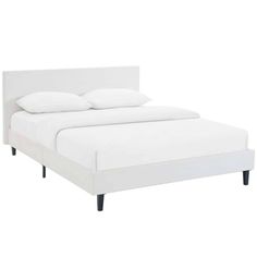 a bed with white sheets and pillows on it's headboard, against a white background