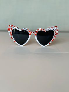 Bedazzled retro heart sunglasses perfect for any University of Texas fan.  Use these sunglasses to complete your Game Day outfit or gift to any UT Longhorn, Hook 'Em! Please note this is a made to order item and no two sunglasses will be the same.  Exact color and placement of gems will have slight variation. Ensuring your purchases arrive in perfect condition is important to me! Sunglasses are packaged in hard, sturdy boxes with crinkle cut packing paper. All sunnies are shipped with a squeeze Valentine's Day Gift Sunglasses With Tinted Lenses, Heart-shaped Glass Sunglasses For Gift, Heart-shaped Glass Sunglasses As Gift, Heart-shaped Sunglasses For Valentine's Day Gift, Ut Longhorns, Retro Heart, Packing Paper, Texas Gifts, Rhinestone Sunglasses