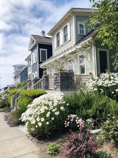 a house with many flowers in front of it