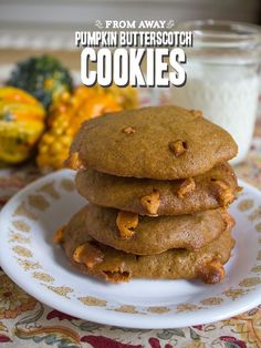 a stack of pumpkin butterscotch cookies on a plate next to a glass of milk