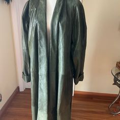 Vintage Full Length Soft Leather Coat Fully Lined With Two Pockets. Shiny, Looks Like A Snakeskin, Color Curry Leaves/ Dark Green. Absolutely Gorgeous Piece!!! This Is A Unique Item Will Bring Everyone Eyes On It! Measurements Pit To Pit 28” Sleeves Shoulders To Hem 32” Length 52" Fitted Long Green Outerwear, Elegant Long Khaki Outerwear, Fitted Olive Outerwear, Chic Long Green Outerwear, Chic Fitted Olive Outerwear, Fitted Olive Long Sleeve Outerwear, Olive Fitted Long Sleeve Outerwear, Elegant Oversized Green Outerwear, Elegant Green Oversized Outerwear