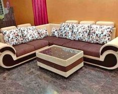 a living room filled with lots of furniture next to a red curtained window sill