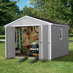 a small storage shed with the door open