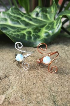 "This beautiful wire wrapped ring is made of tarnish resistant copper wire and a 6mm Opalite stone. This unique adjustable design makes it so you can change which finger you wear it on and makes on and off a breeze. I do ask for a ring size so that it is the best fit for you. If a different size is needed, please let me know in the \"note to seller\" box at checkout.  CARE: These rings can bend easily, so it is best to take off before sleeping. NOTE: Each ring is handmade to order and may not lo Hemp Bracelets, Wire Wrapped Ring, Wire Wrapped Rings, Wrap Rings, Matching Bracelets, Ring Unique, Hippie Chic, Adjustable Bracelet, Rings Statement