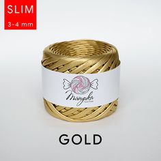 a coil of gold colored twisted rope on a white background with the words misshapenee written across it