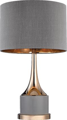 a table lamp with a grey shade on top and gold trim around the base,