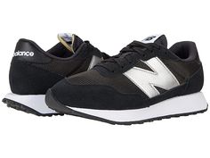 New Balance Classics 237v1 - Women's Shoes : Black/Silver Metallic : Add the perfect pop of retro to your morning jaunt with the iconic silhouette of the New Balance Classics 237v1 sneakers. Casual shoes with suede and mesh or textile uppers in a sporty silhouette. Foam-padded collar and tongue. Soft linings and a removable foam insole provide all-day comfort. Traditional lace-up closure. TPU heel insert for extra support. ENCAP® midsole for cushioning. Durable rubber outsole. Imported. Measurem Sporty Mesh Sneakers With Contrast Sole, Mesh High-top Running Shoes With Contrast Sole, Nylon Running Shoes With Contrast Sole For Sports, Running Sneakers With Contrast Sole And Mesh Material, Mesh Sneakers With Contrast Sole For Running, Running Sneakers With Mesh And Contrast Sole, Mesh Sneakers With Contrast Sole For Running Errands, Mesh Sneakers With Contrast Sole For Errands, Mesh Running Shoes With Contrast Sole And Round Toe