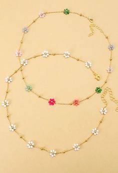 A vibrant charm necklace to brighten up your look! An arrangement of colorful beads intricately woven together to create a charming floral centerpiece.  DIMENSIONS Length: 15" Ext: 3' ball ext. Clasp: lobster claw Metal Finish: Gold Plated Product: Lead & Nickel Compliant Anti-tarnish: Double E-Coating Dainty Multicolor Flower Jewelry, Multicolor Dainty Jewelry With Flower Charm, Multicolor Flower Charm Necklace For Spring, Multicolor Flower Necklace For Spring Gift, Multicolor Flower Necklace As Spring Gift, Multicolor Flower Decorated Jewelry For Spring, Spring Multicolor Flower Necklace With Colorful Beads, Spring Flower Necklace With Colorful Beads, Dainty Multicolor Flower Necklace