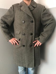 Absolutely rare find! 1960s or late 1950s Aquascutum mens' authentic winter double breasted coat Scottish Tweed Herringbone Fur fully lined  Three pockets at front with rounded flaps + 1 inner pocket raglan sleeve Made by Aquascutum in England Quite heavyweight - almost 2 kilos Size L (on photo my son - he is in between M and L - so this coat is roomy for him) Measurements taken in flat position  Height 40"/102 cm pit to pit 23"/54,5 cm 1 shoulder 6,5"/15,5 cm + sleeve 26"/66 cm Condition  Good! Coat keeps its shape, fabric is still stiff  It has been dry cleaned and I kept on the air and under the sun (covered,of course) Flaws - lease check my video https://youtube.com/shorts/Of0_A3OlEuM?feature=share I have found  in 3 places 1. In the left shoulder area 2 tiny - but they are not deep an Retro Formal Winter Outerwear, Vintage Fitted Long Pea Coat, Vintage Winter Outerwear With Double Button Closure, Vintage Pea Coat With Double Button Closure For Fall, Retro Wool Double-breasted Outerwear, Retro Double-breasted Wool Outerwear, Retro Winter Outerwear With Notch Lapel, Retro Notch Lapel Outerwear For Winter, Vintage Double-breasted Winter Outerwear