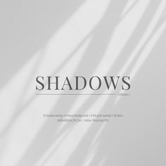 shadows over white paper with the word shadow on it's bottom right hand corner