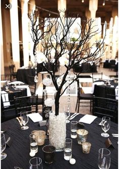 an elegant centerpiece is displayed on a table