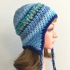 a mannequin head wearing a crocheted hat