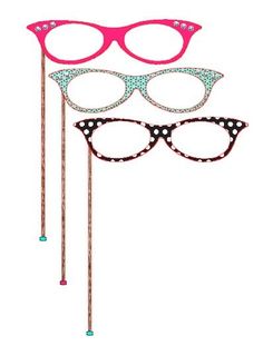 two pairs of pink glasses with polka dots on them and one pair of eyeglasses