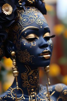 a woman with blue face paint and gold jewelry