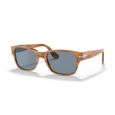 From the rich coloring to the masculine shape, Persol's 3288S delivers a classic summer accessory. The Italian-made sunglasses feature a sleek silhouette that combines a square acetate frame and varying shades of brown. Its warm Havana hue is paired with blue-tinted crystal lenses, while the temple is branded with Persol's signature arrow. The brand's trademark Meflecto system is hidden inside, delivering flexible comfort for all-day wear. Classic Square Frame Sunglasses For Summer, Classic Square Frame Sunglasses For Beach, Classic Brown Square Frame Sunglasses, Classic Sunglasses With Tinted Lenses For Beach, Classic Tinted Sunglasses For Beach, Classic Wayfarer Sunglasses For Beach, Classic Brown Sunglasses For Summer, Classic Brown Sunglasses With Uv Protection, Classic Brown Polarized Sunglasses