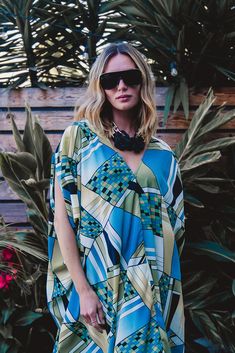 Limited run on this new and graphic take on the classic JG Caftan. This Pucci inspired print is thew perfect add on to a glam dinner or cover up by the pool. Our caftans are a voluminous one-size fits all garment, approximately 50" in length. The intention of this shape is to celebrate the magic of fabric and its captivating dance with form. JG one-size caftans are collected from petite to plus sized collectors, and everything in between. Machine wash cold, gentle cycle, and hang dry for optimal fabric preservation. Chic Printed V-neck Kaftan, Chic V-neck Printed Kaftan, Printed V-neck Kaftan For Poolside, Beach Kaftan With Kimono Sleeves And Abstract Print, Chic Multicolor Kaftan, Chic Beach Poncho With Batwing Sleeves, Chic Oversized Kaftan For Vacation, Chic Blue Kaftan Beach Cover-up, Chic Blue Kaftan For Beach Cover-up