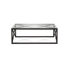 a black coffee table with glass top and metal frame on an isolated white wall background