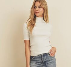 This super soft ribbed knit mock neck top is effortlessly stretchy and cozy! Short sleeve Mock neck Stretchy and soft 50% Rayon, 28% Polyester, 22% Nylon Offered in Sizes: S, M, L White Ribbed Turtleneck For Layering, Chic White Ribbed Turtleneck, Trendy High Neck Soft Knit Top, Trendy Soft Knit High Neck Top, White Fitted Mock Neck Top Trendy, White Fitted Mock Neck Top Trendy Style, Trendy Fitted White Mock Neck Top, Trendy White Fitted Mock Neck Top, Casual White Mock Neck Top For Work