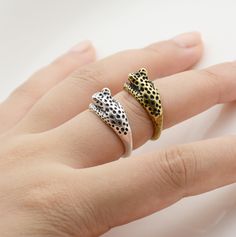 • Handcrafted Wrap Rings – Wear Felicity leopard wrap ring are carefully designed by jewelry artists to ensure they’re stylish and durable. They’re the perfect addition for animal lovers everywhere.• Classic, Intricate Detailing – Each small wrapped ring features the “leopard”, a leopard that is peering over your finger to remind you how much he loves you! • Wonderful Gift Choice – Animal wrap rings make a great birthday, anniversary, holiday, or “just because” gift for special women and girls i Leopard Jewelry, Leopard Accessories, Animal Wrap Rings, Shark Ring, Animal Themed Jewelry, Gold Wrap Ring, Silver Wrap Ring, Animal Rings, The Leopard