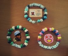 three bracelets with different designs on them and a photo of a man in the middle