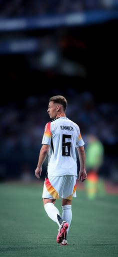 a male soccer player in action on the field