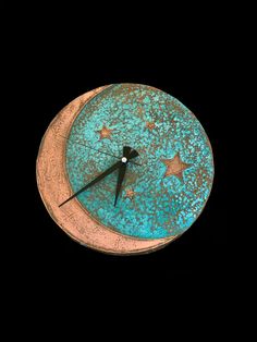 a blue clock with stars on the face