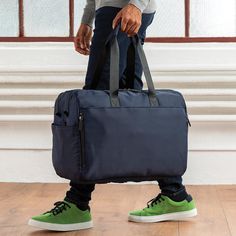 Overview Our high-performance LEIGH Duffle is expertly crafted with the seasoned traveler in mind. The exterior is made of 100% sustainable nylon while the interior is fully lined with IONIC+™ antimicrobial fabric featuring high-tech silver fibers which prevent odor. Includes a dedicated adjustable footwear space to accommodate multiple pairs of shoes and a pair of tall boots, a separate clothing compartment for a multi-day trip, plus a 15” padded laptop sleeve with pockets for cords, chargers, Tall Boots, Laptop Sleeve, Laptop Sleeves, High Tech, High Performance, Duffle Bag, Laptop, Exterior, Navy