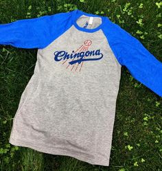 CHINGONA Shirt, Baseball T-Shirt (GREY), Dodgers Shirt Heather Grey Cotton Tops With Screen Print, Heather Grey Graphic Print Top For Fan Merchandise, Heather Grey Crew Neck Top With Screen Print, Heather Grey Graphic Print Top For Fans, Pre-shrunk Cotton Tops In Athletic Heather, Blue Tops With Screen Print For Baseball Season, Long Sleeve Graphic T-shirt For Baseball Season, Long Sleeve Graphic Print T-shirt For Baseball Season, Long Sleeve T-shirt With Graphic Print For Baseball Season