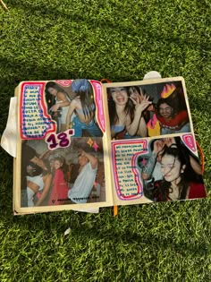 an open book with photos on it laying in the grass