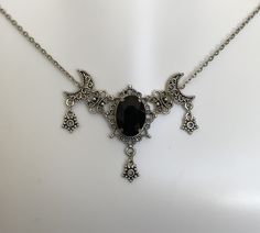 "This is a new handmade necklace. It is made with antiqued silver plated filigrees, accented with a high quality JET BLACK glass rhinestone. Decorated portion is 2 1/2\" wide and 1 3/4\" tall in the center. Necklace is adjustable 15-18\" with a lobster clasp and chain extender. If you would like a different length, please send us a message." Gothic Necklace Aesthetic, Romantic Goth Accessories, Gothic Silver Crescent Necklace, Gothic Crescent Silver Necklace, Adjustable Oxidized Gothic Necklace, Adjustable Gothic Antique Silver Necklace, Victorian Gothic Jewelry, Star Goddess, Goth Necklace