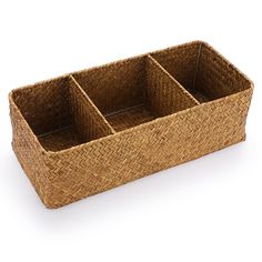 an empty wicker basket with three compartments on the bottom and one section open to show it's contents