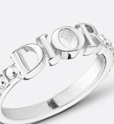 The Dio(r)evolution ring is both modern and timeless. Made with silver-finish metal, the style features a central Dior signature with a white crystal pavé. The ring can be paired with other creations from the Dio(r)evolution line.. X Dior Ring Silver, Dior Star, Icon Shoes, Dior Jewelry, Jewelry Accessories Ideas, White Crystals, Miss Dior, Silver Cufflinks, Fashion Jewelry Earrings