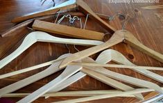 several wooden clothes hangers on a table