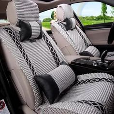 the interior of a car with beige and brown seat covers on it's sides