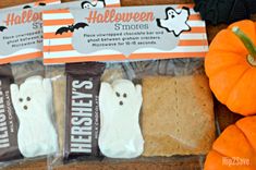 three halloween treats in bags on a table